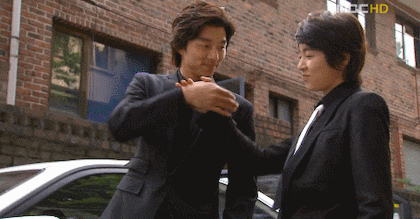 Gong Yoo and Yoon Eun-hye doing a bro fist in Coffee Prince
